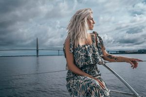 Waterfront portrait of a woman at Charleston Harbor Marina.