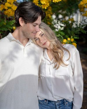 A couple posing for a portrait at Philadelphia Alley in Downtown, Charleston, SC