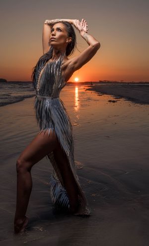 Outdoor beach portrait of a woman at Folly Beach, SC.