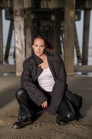 Coastal portrait session with ocean backdrop at Folly Beach, South Carolina.