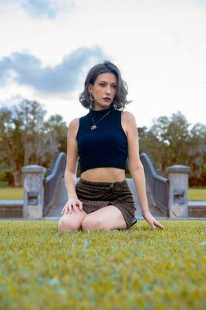 Natural light portrait session at Hampton Park with Charleston garden backdrop.