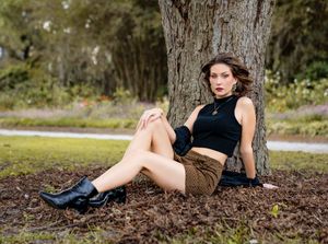 Woman portrait under oak trees at Hampton Park in Charleston, SC.