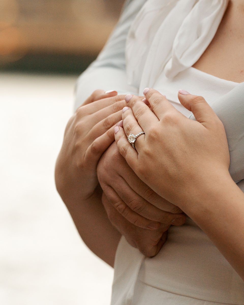 Close-up view of hands with engagement ring showing delicate details and sparkle in natural lighting shot during a sydney engagement session