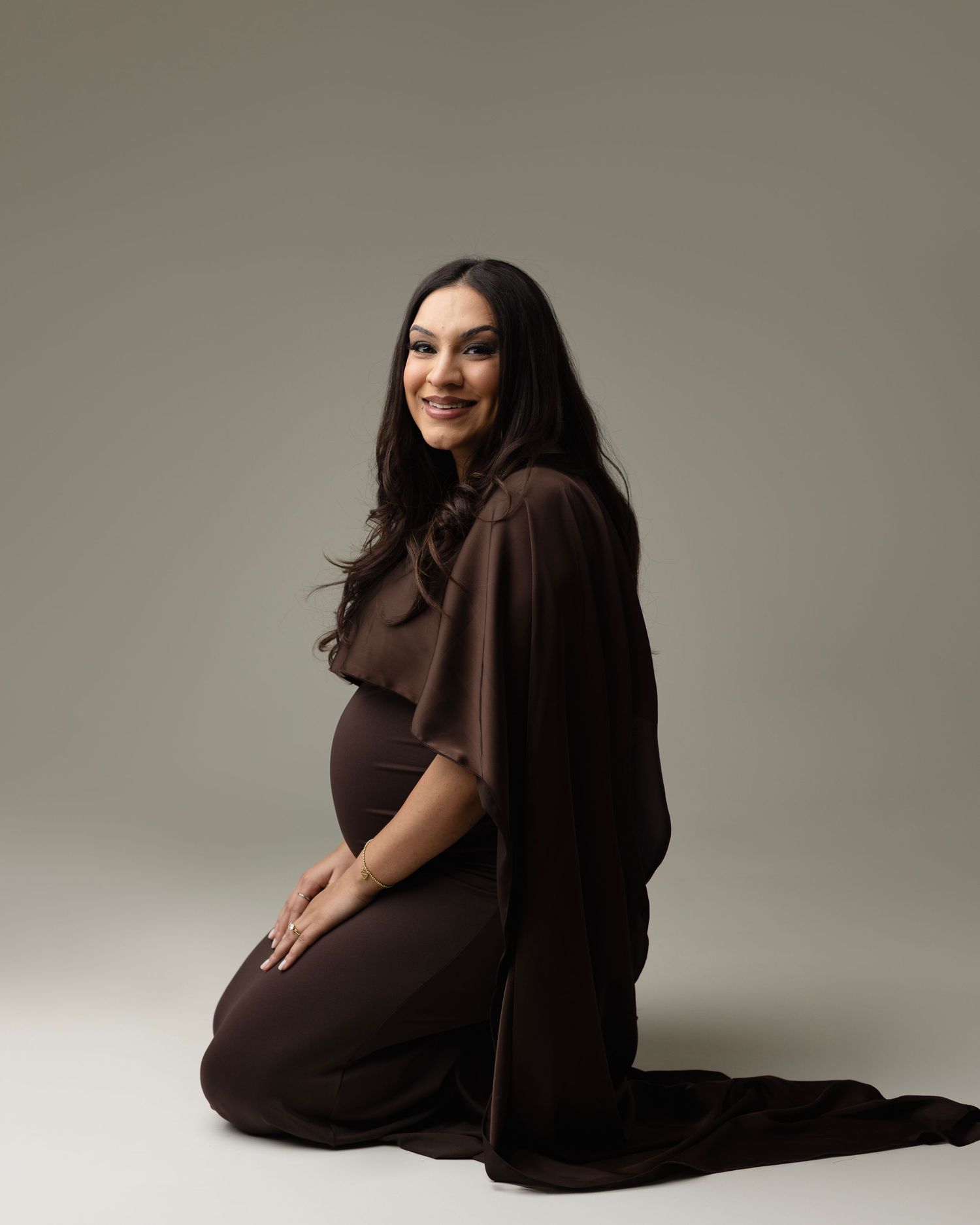 A sequence of profile photos showing a pregnant woman in a brown dress against a neutral background. Elizabeth Lang Photography Surrey