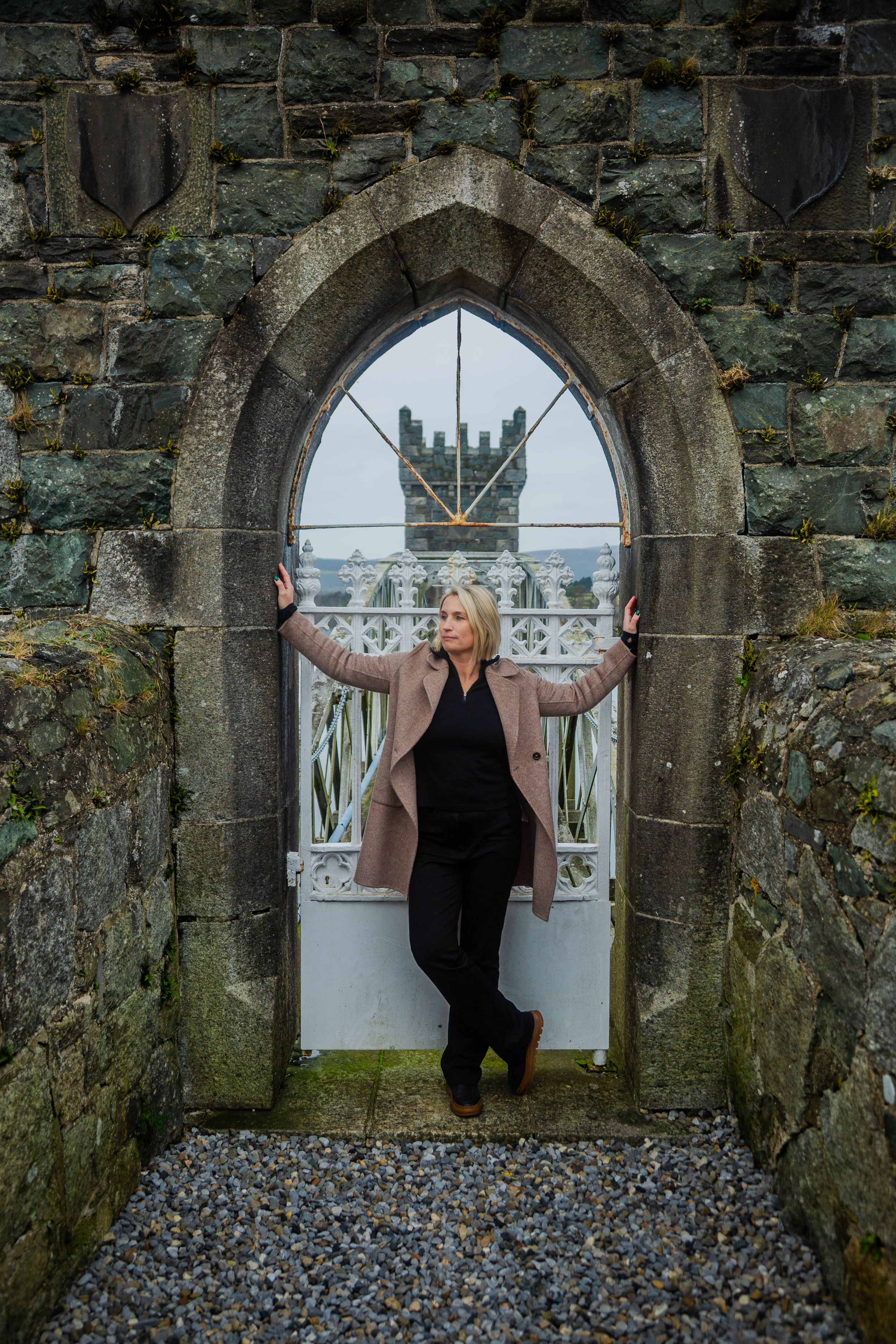 Lady posing in historic stone archway of the Draw Tower at Vartry Reservoir