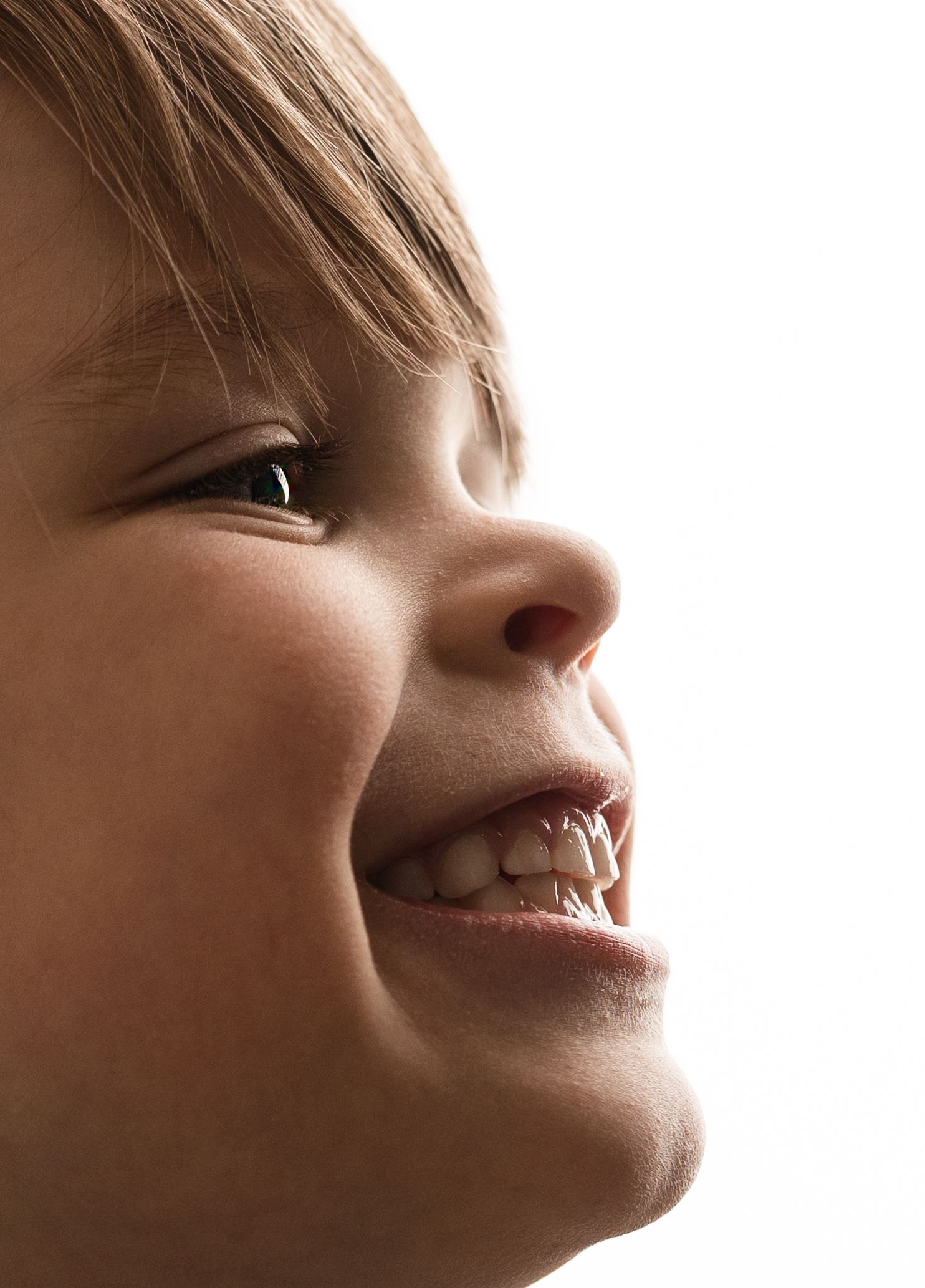 Detail shots on a smiling little boy's side profile captured during a milestone session with Charlottesville family and baby photographer.