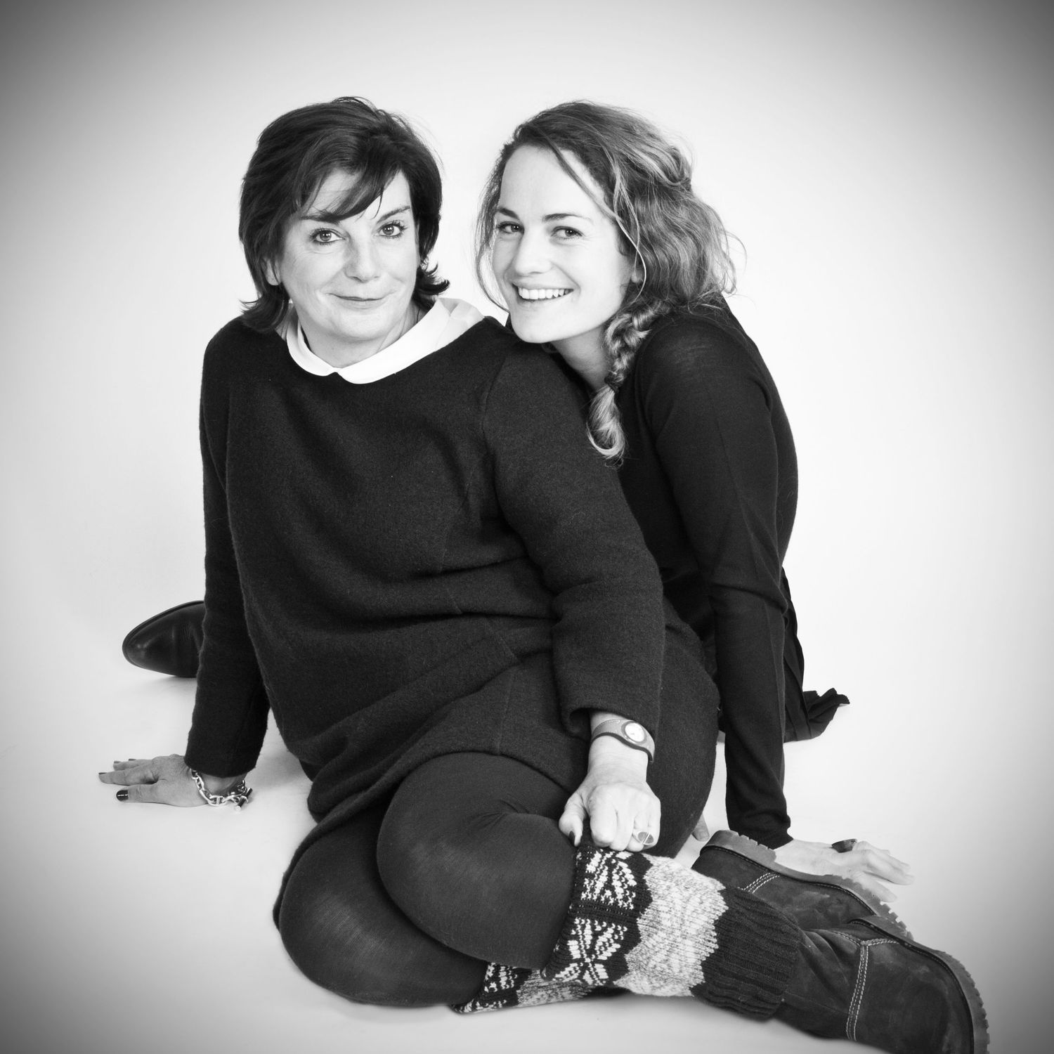 Black and white portrait photography session in studio setting.