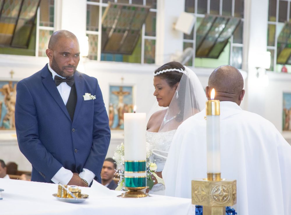 Wedding guests enjoy refreshments and hors d'oeuvres during an elegant reception with navy and white decor.