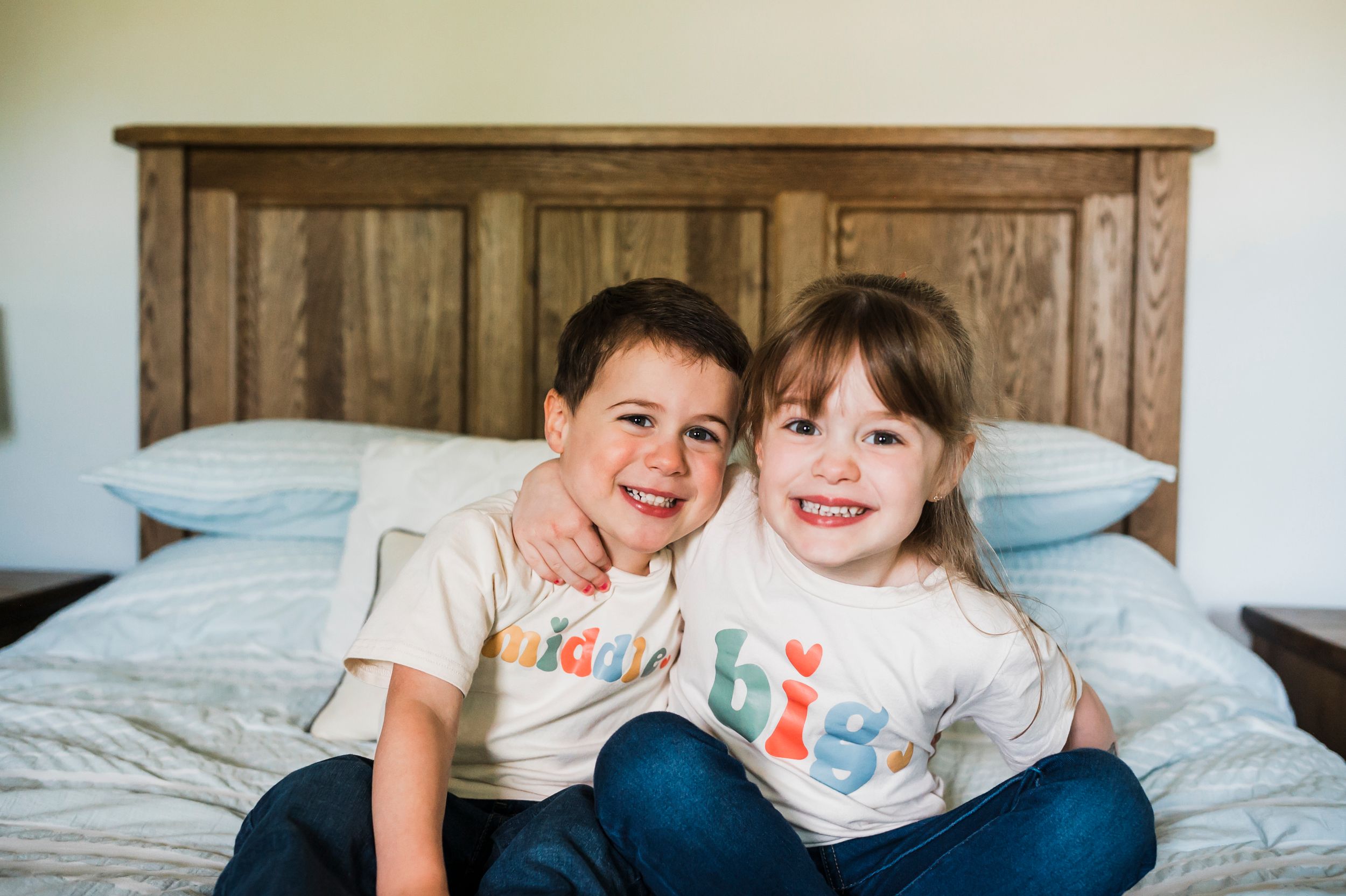 A series of candid moments showing children playing and laughing together on a light colored bed.