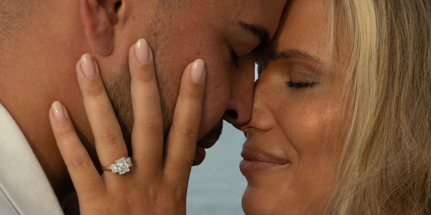 Close-up intimate moment between couple with soft lighting.