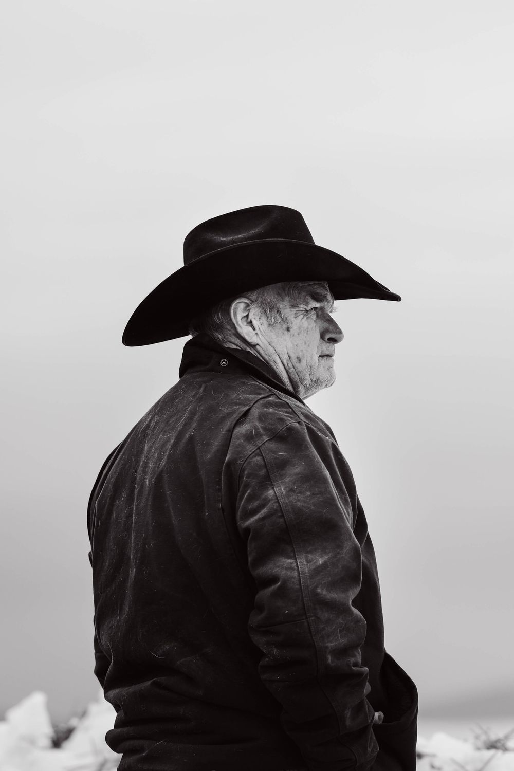 Moody black and white cowboy portrait
