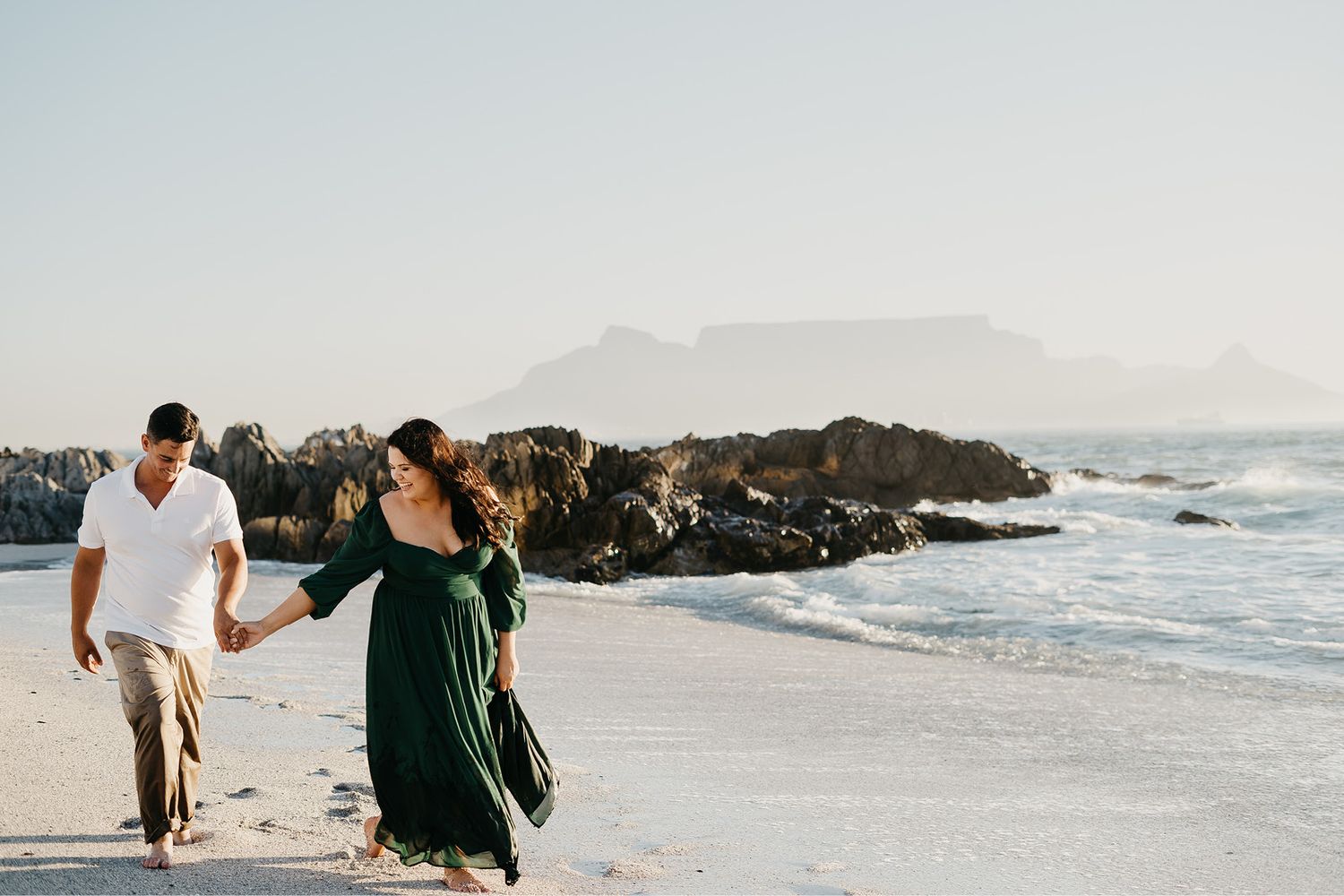 Couple laughing while enjoying time with alpacas for their engagement shoot at Lewis Family Farm in South Africa