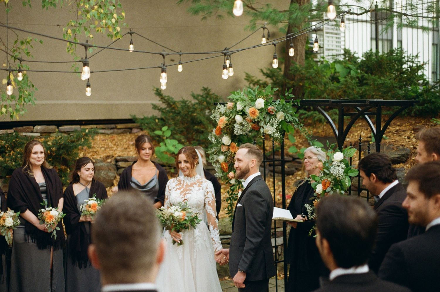 Shot of a couple taking in all the small moments at the alter with their friends and family, shot on film