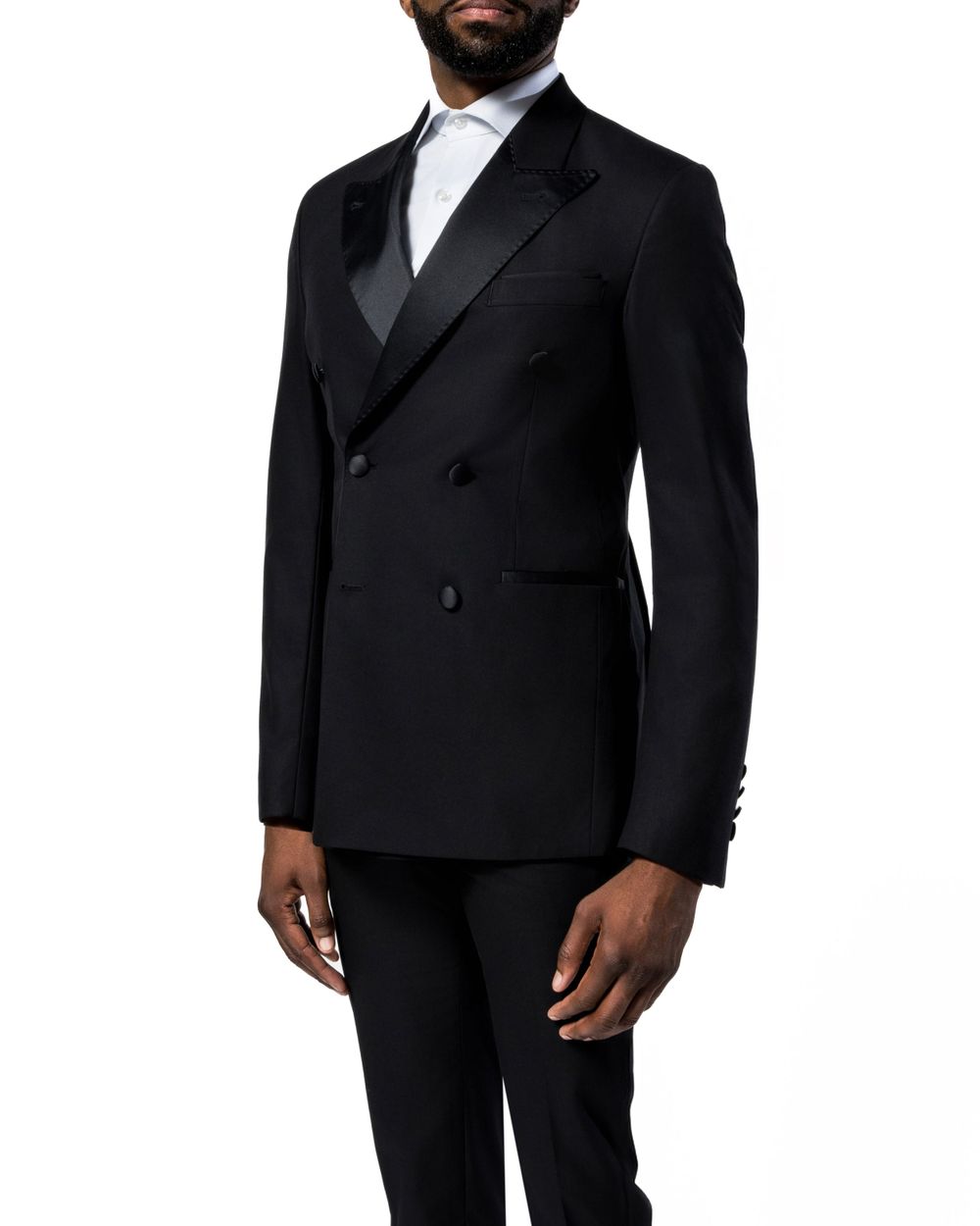 Cropped view of black tuxedo suit with peak lapels on mannequin.