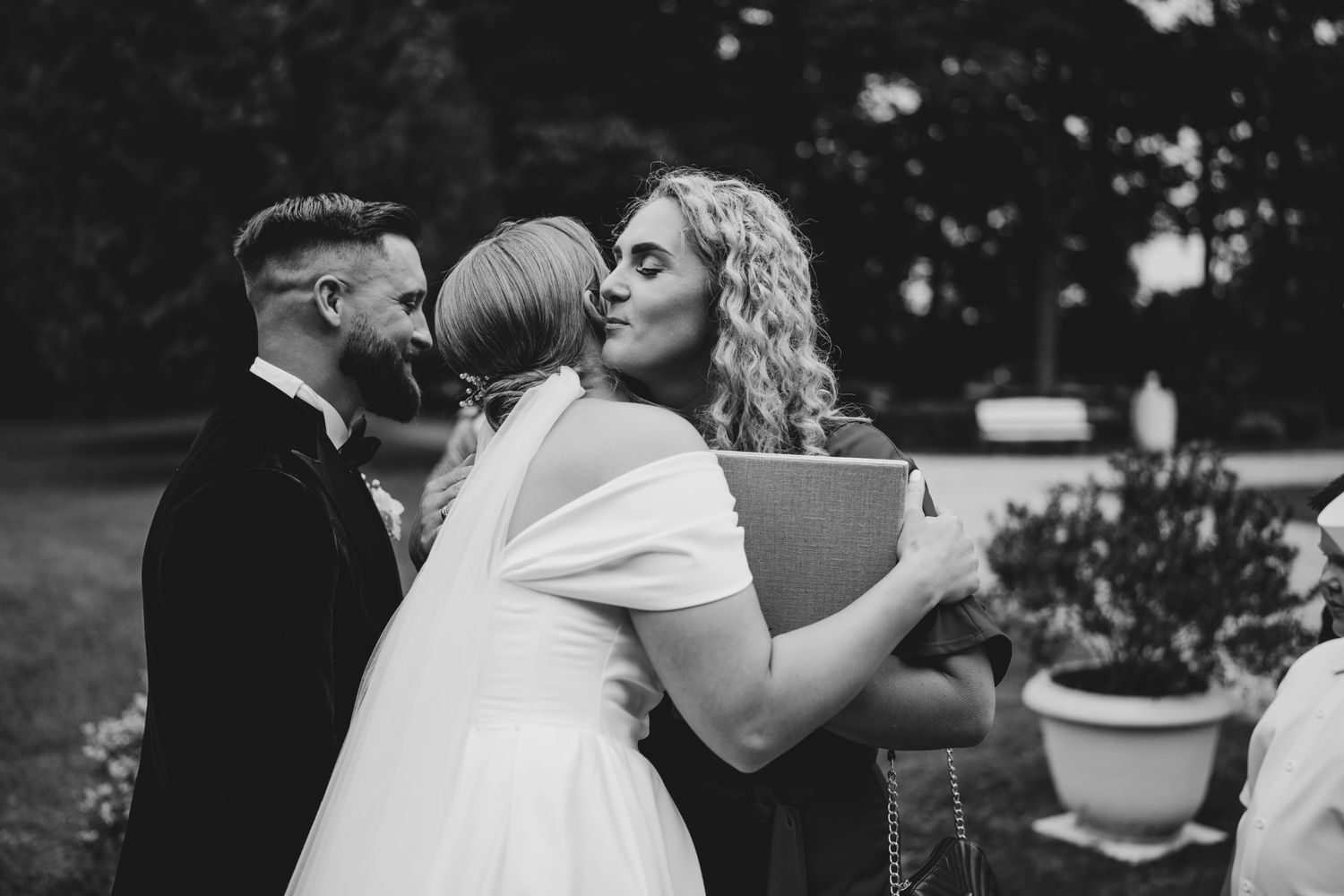 Emotional wedding celebration moments captured in black and white photography.