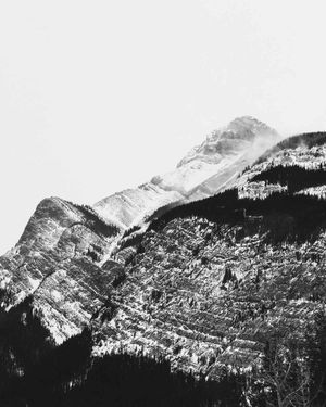 An Ansel Adams inspired shot of a mountain peak between Jasper National Park and Banff, shot in black and white.