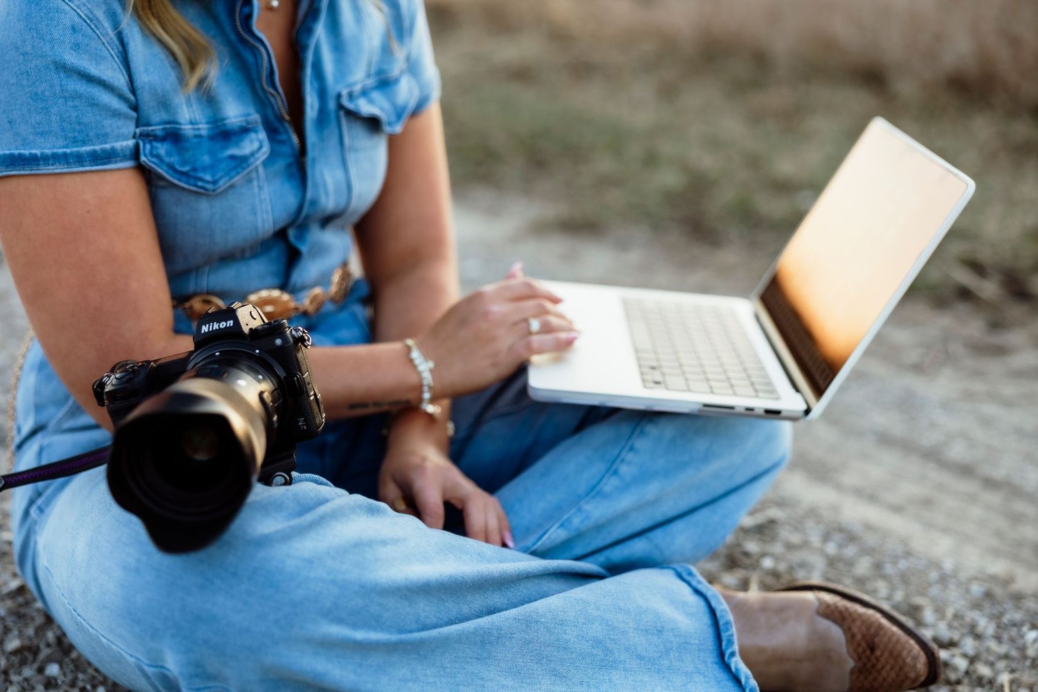 Photographer posing with camera, showcasing their passion for capturing memorable moments and stunning images.