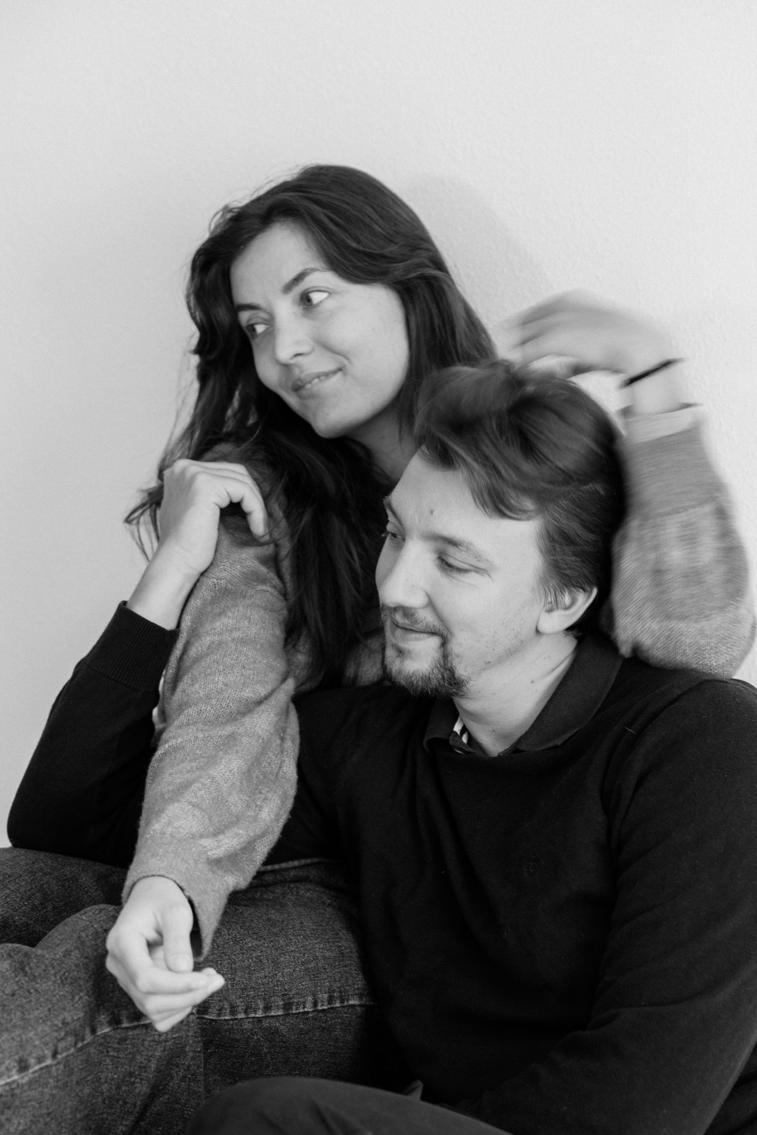 Candid black and white photos showing couple's natural chemistry and connection.