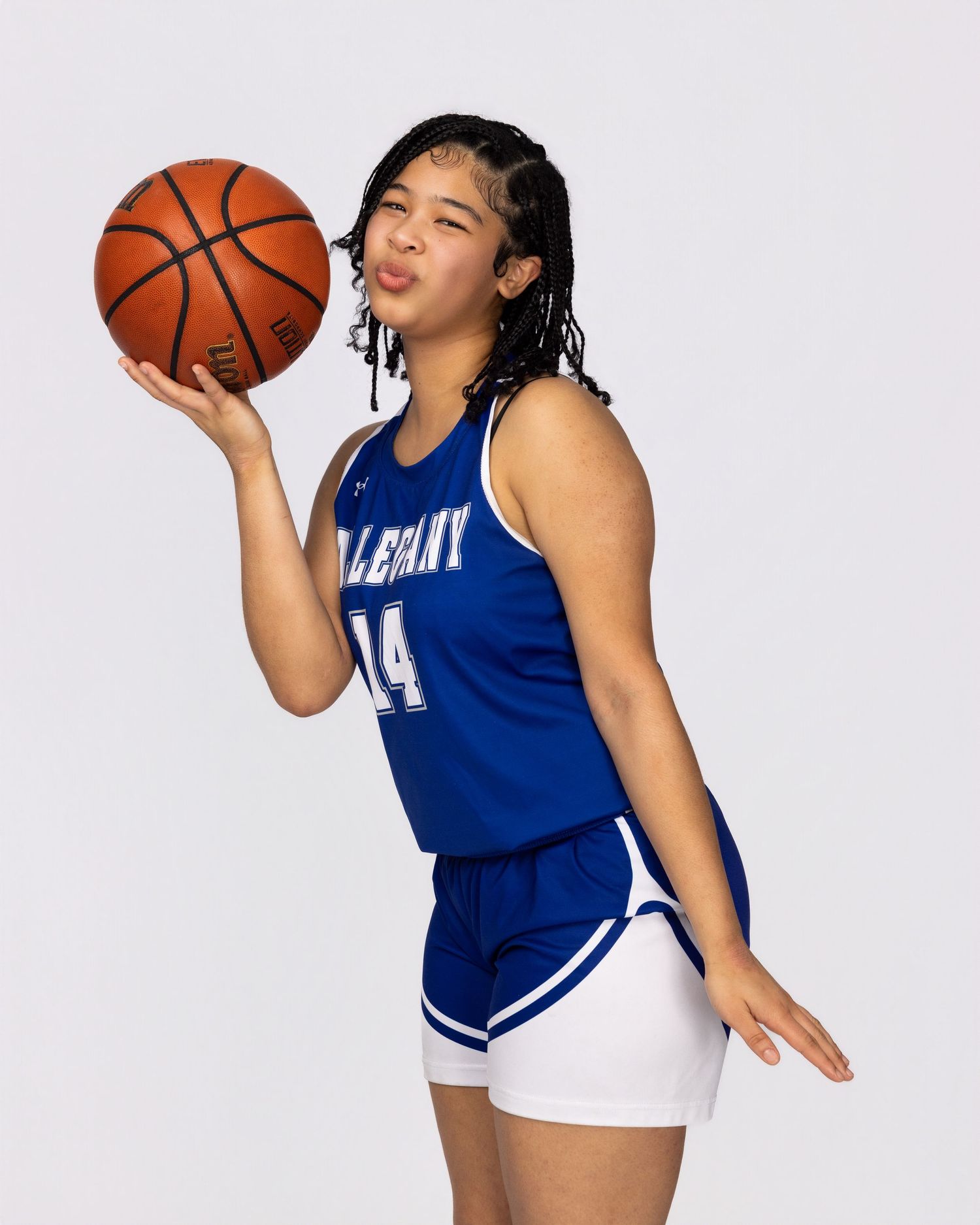 Basketball player in blue uniform poses with ball in dynamic action sequence across multiple frames.