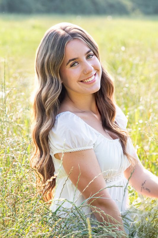 Natural light outdoor headshot of Capella Dance Academy faculty member