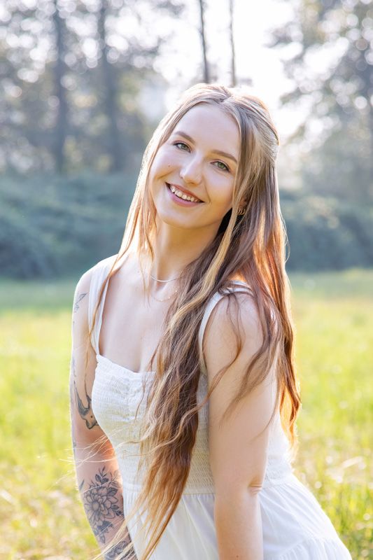 Outdoor headshot of Capella Dance Academy's ballet instructor and choreographer
