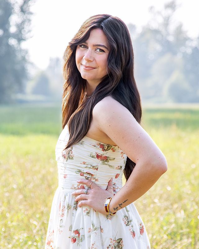 Outdoor headshot of Capella Dance Academy staff member, natural light portrait