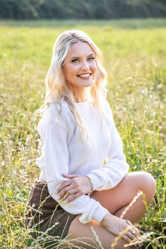 Capella Dance Academy faculty headshot outdoors, soft light professional image