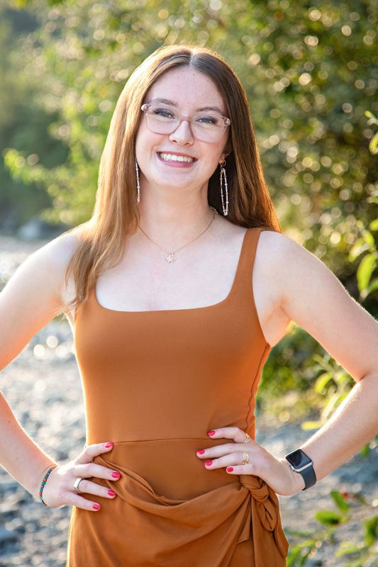 Capella Dance Academy staff headshot outdoors, confident professional portrait