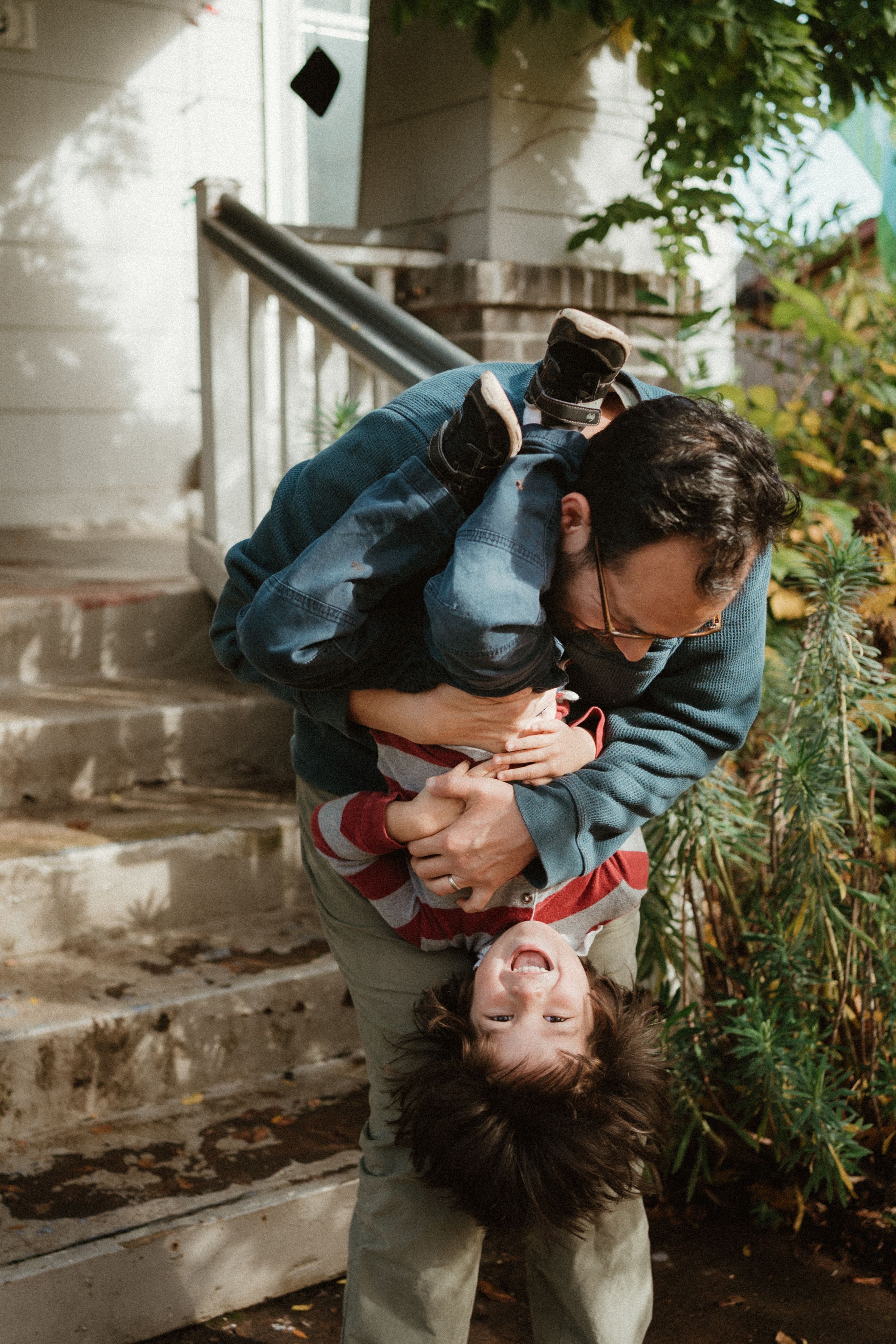Joyful moment captured in a series of playful interactions on a porch with natural lighting.