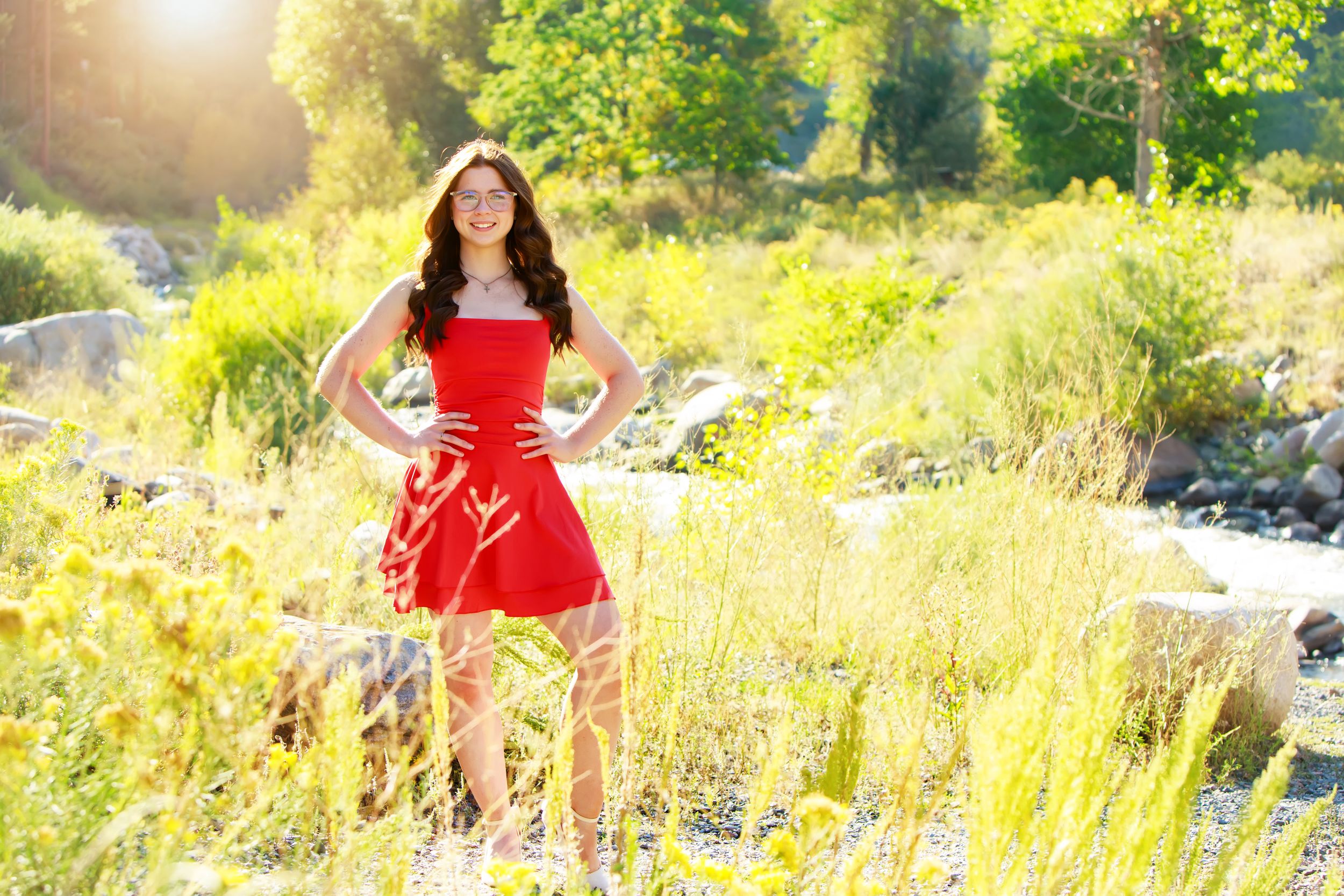 Series of outdoor portraits in a sunny field with tall grass and natural golden lighting.