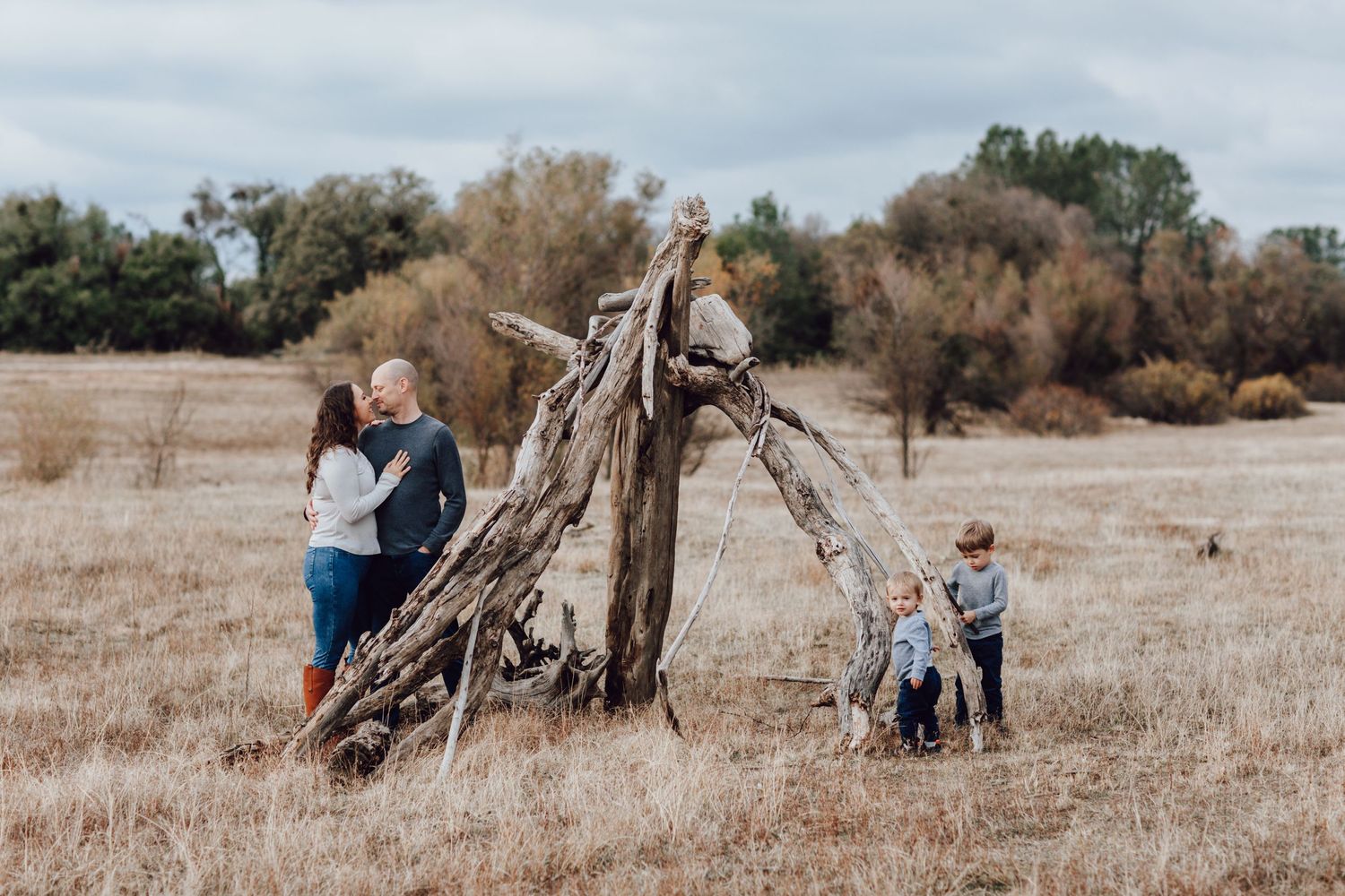 A playful family session in the golden fields of Folsom lake laughing, exploring, and embracing the beauty of wide-open spaces.