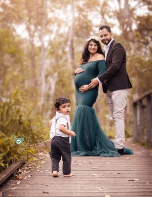 A family maternity photoshoot sequence on a wooden boardwalk in a natural outdoor setting during golden hour.