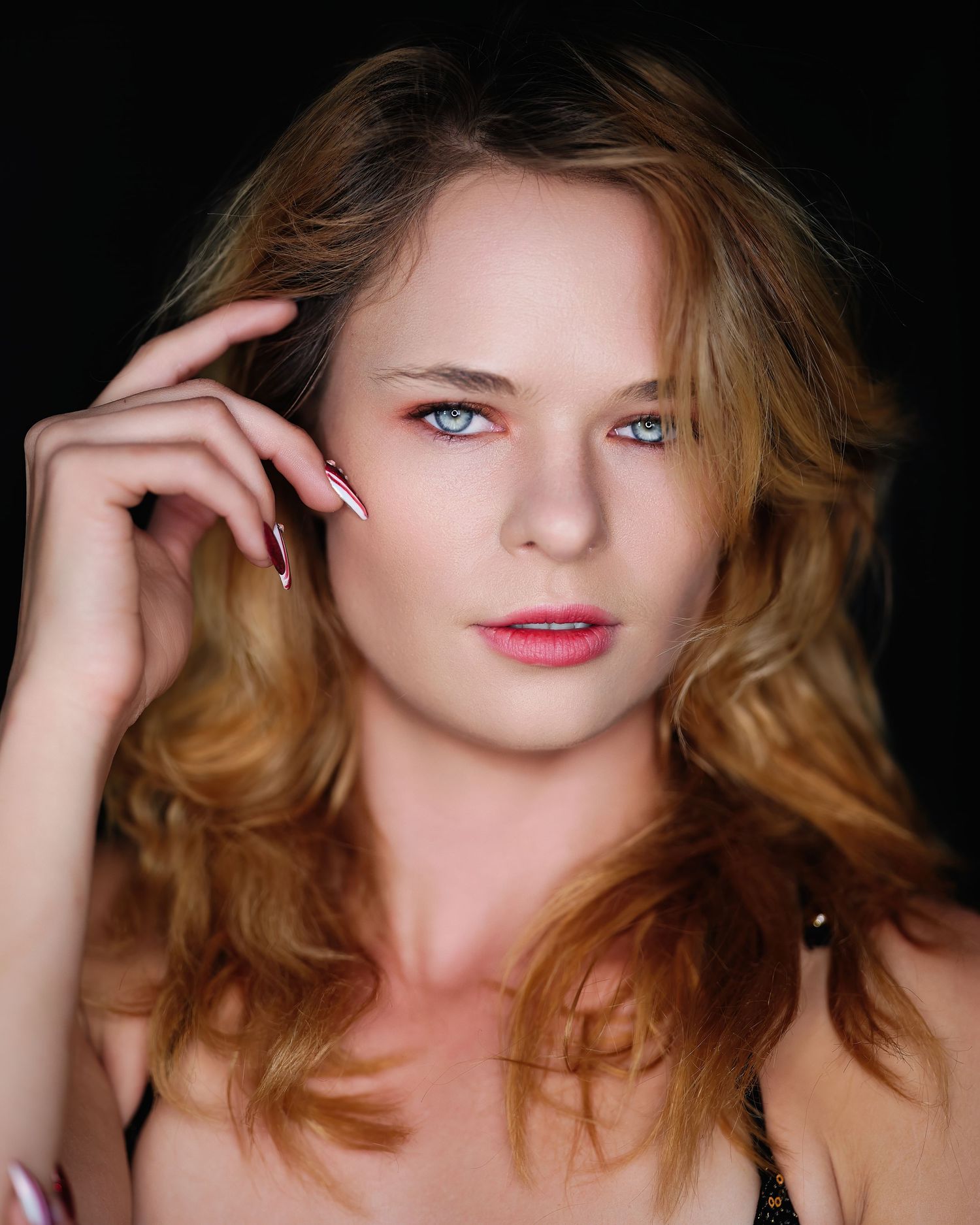 David G Holt Photography - Close-up beauty portrait with soft lighting highlighting blue eyes and natural makeup.