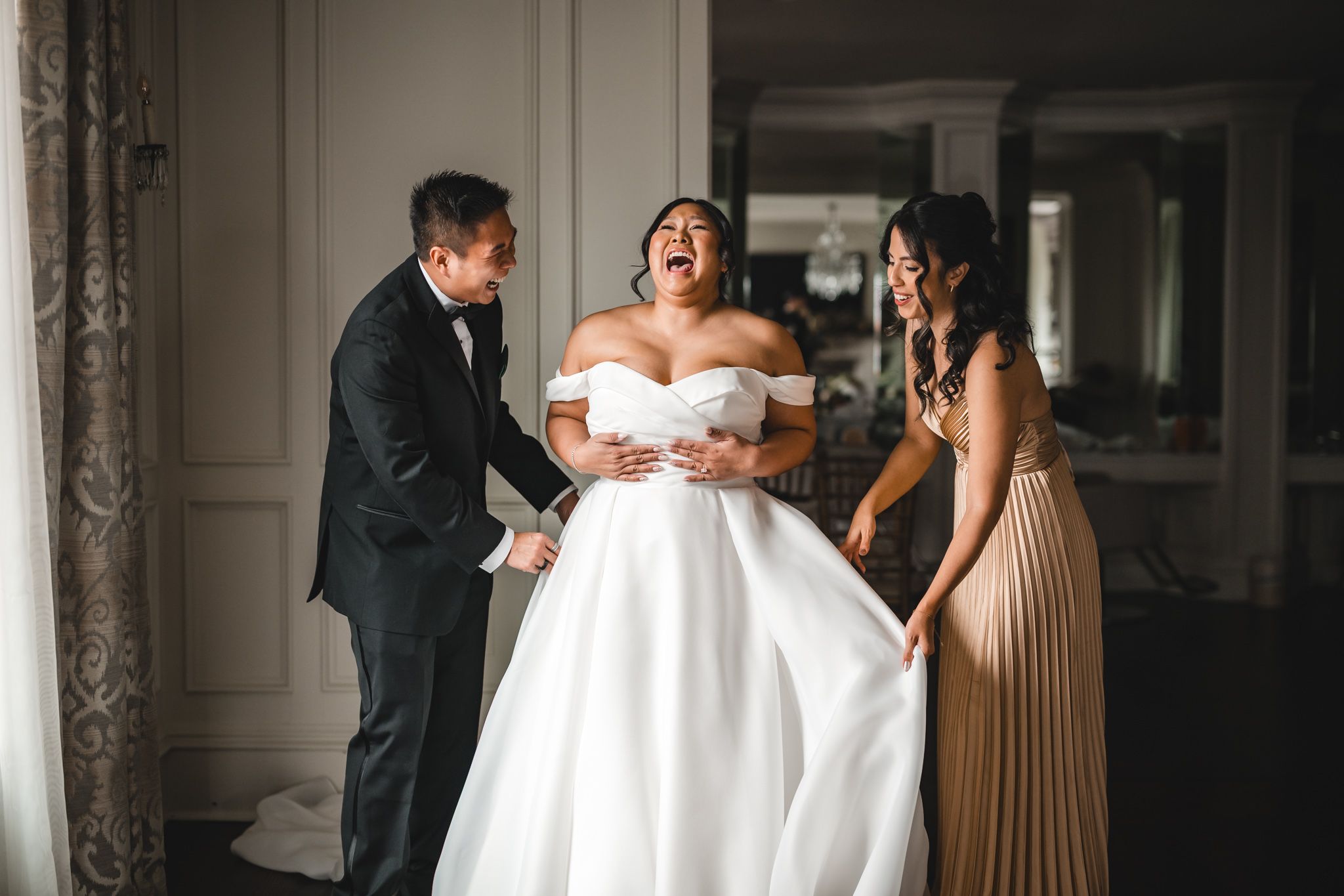 Candid wedding preparation moments captured in dramatic lighting and composition.