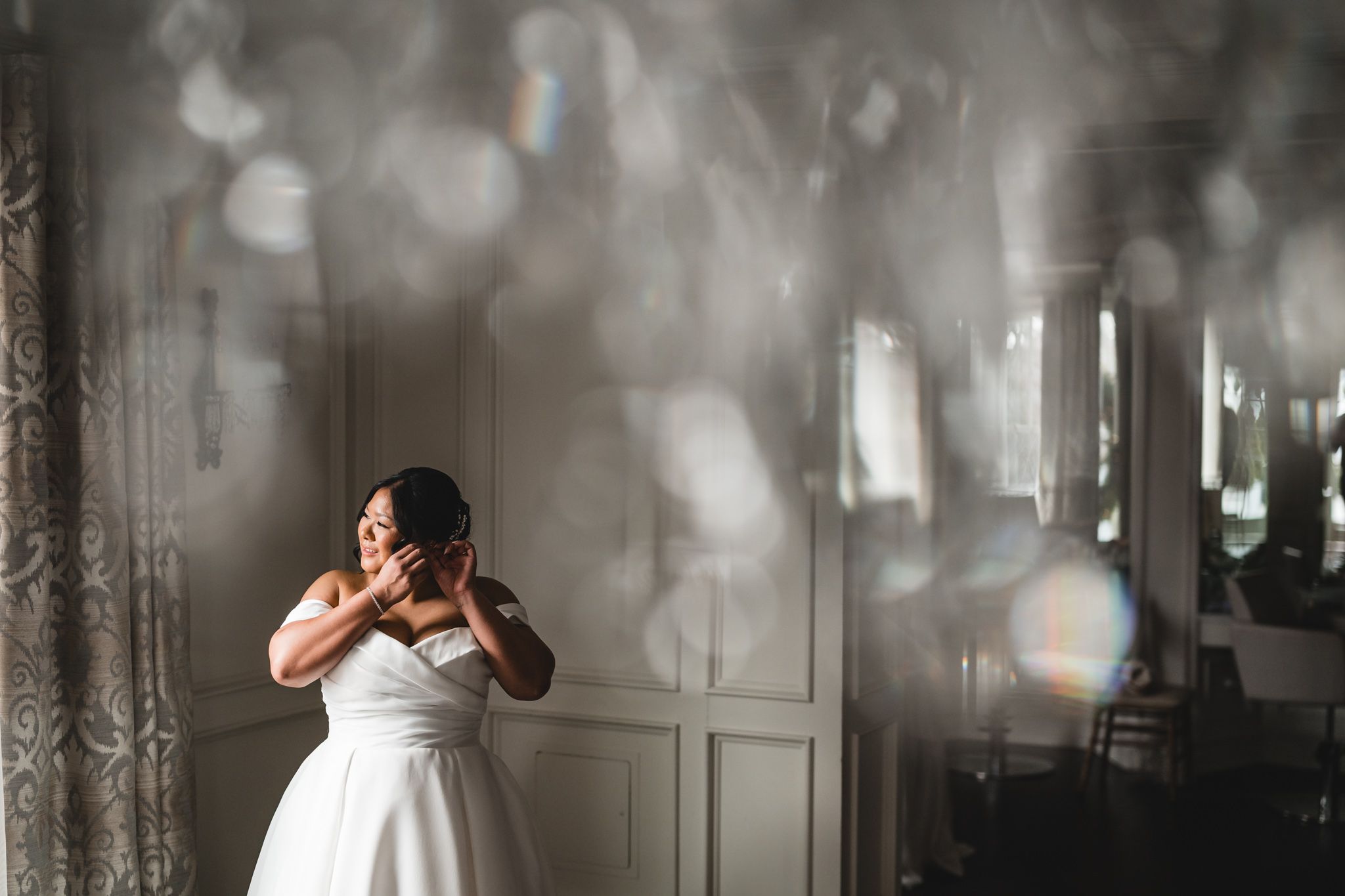 Ethereal bridal portraits with soft, dreamy lighting and elegant window reflections.