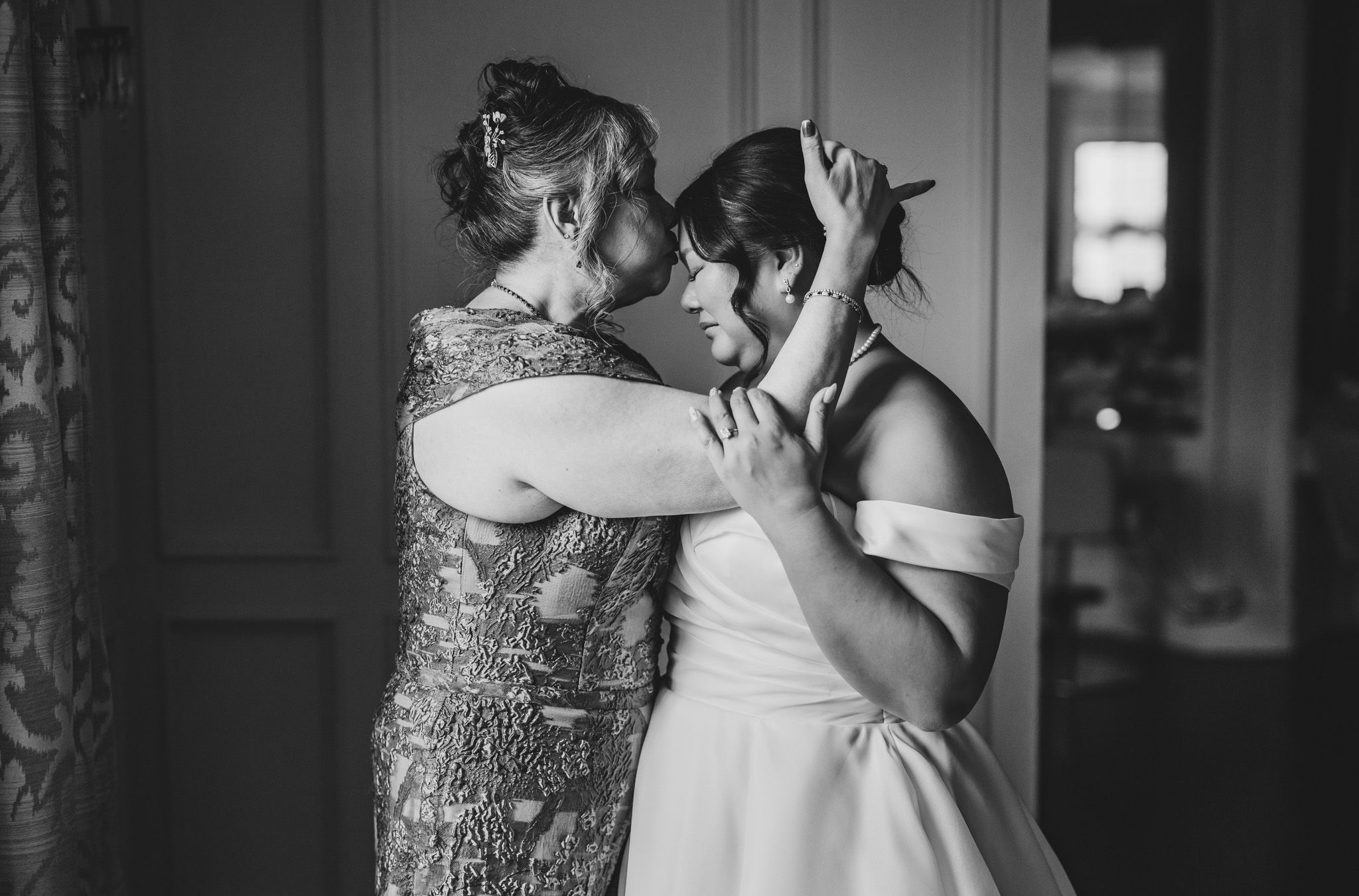 Black and white images capturing intimate pre-ceremony moments.