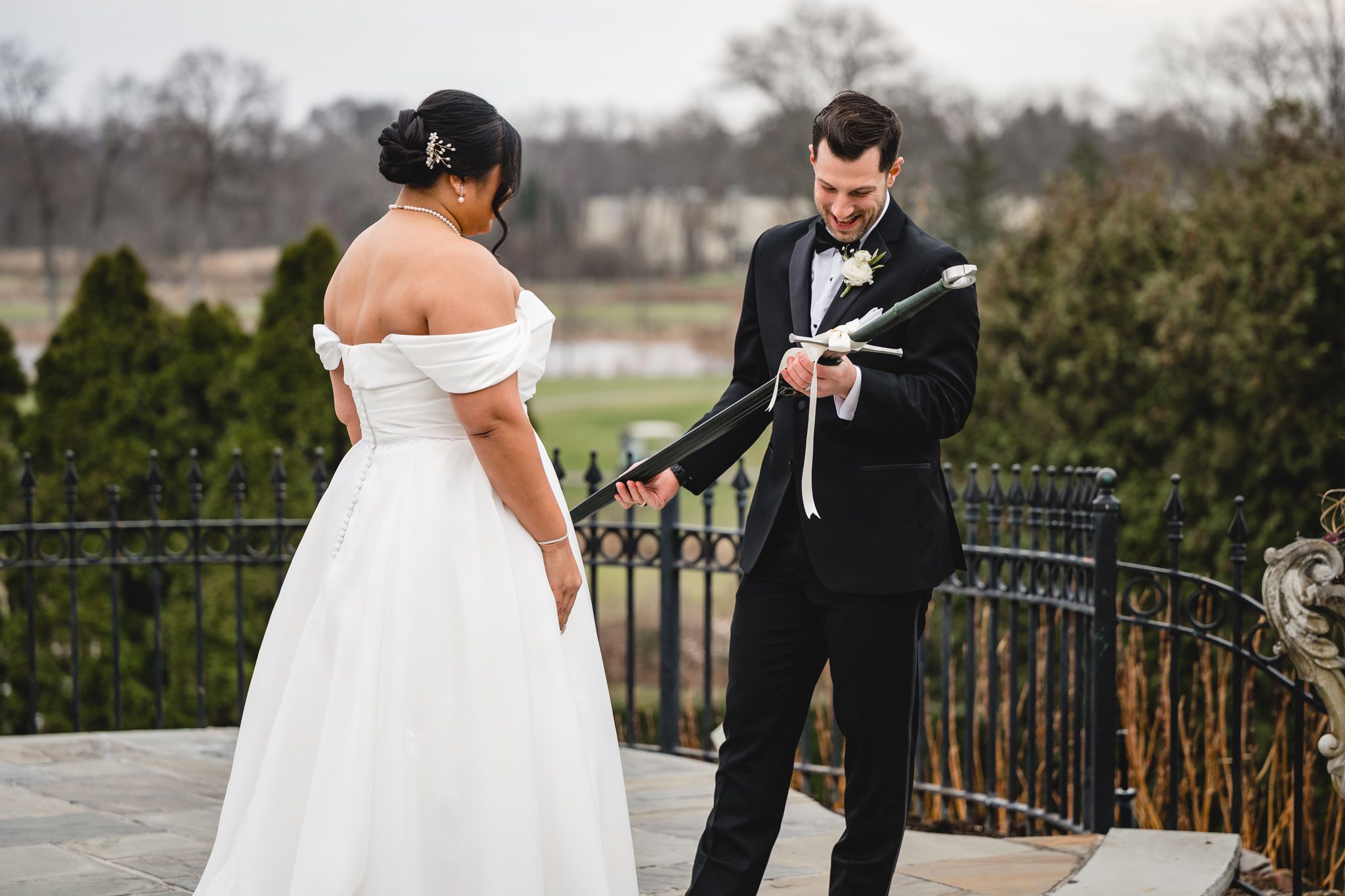 A couple exchanges vows during their outdoor winter wedding ceremony.