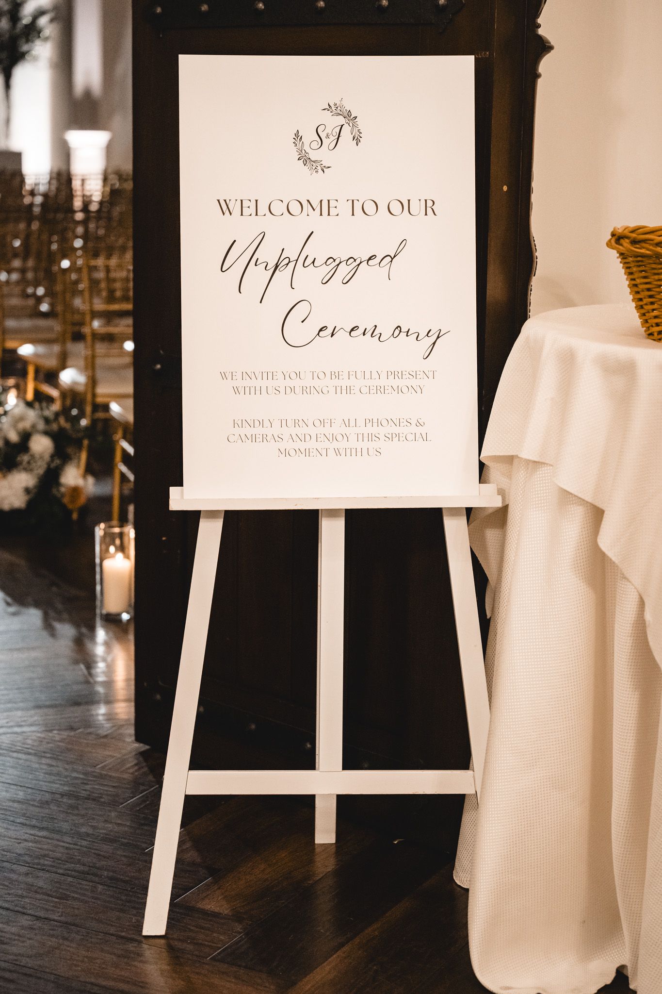 Wedding ceremony signage displaying unplugged ceremony and welcome messages.