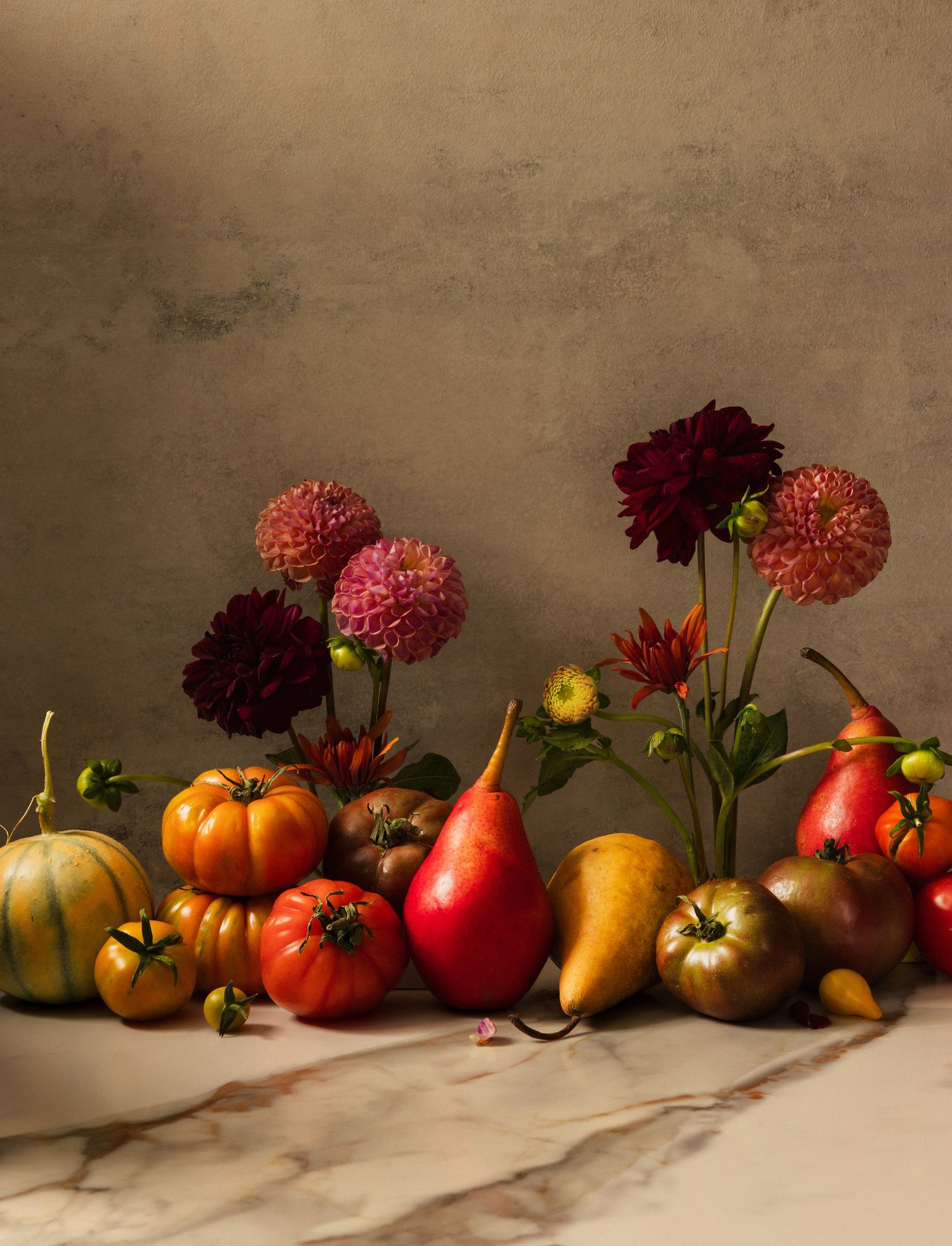 Late Autumn Harvest. Variety of fall produce. Moody still life with vibrant, jewel tone colors, featuring gorgeous florals