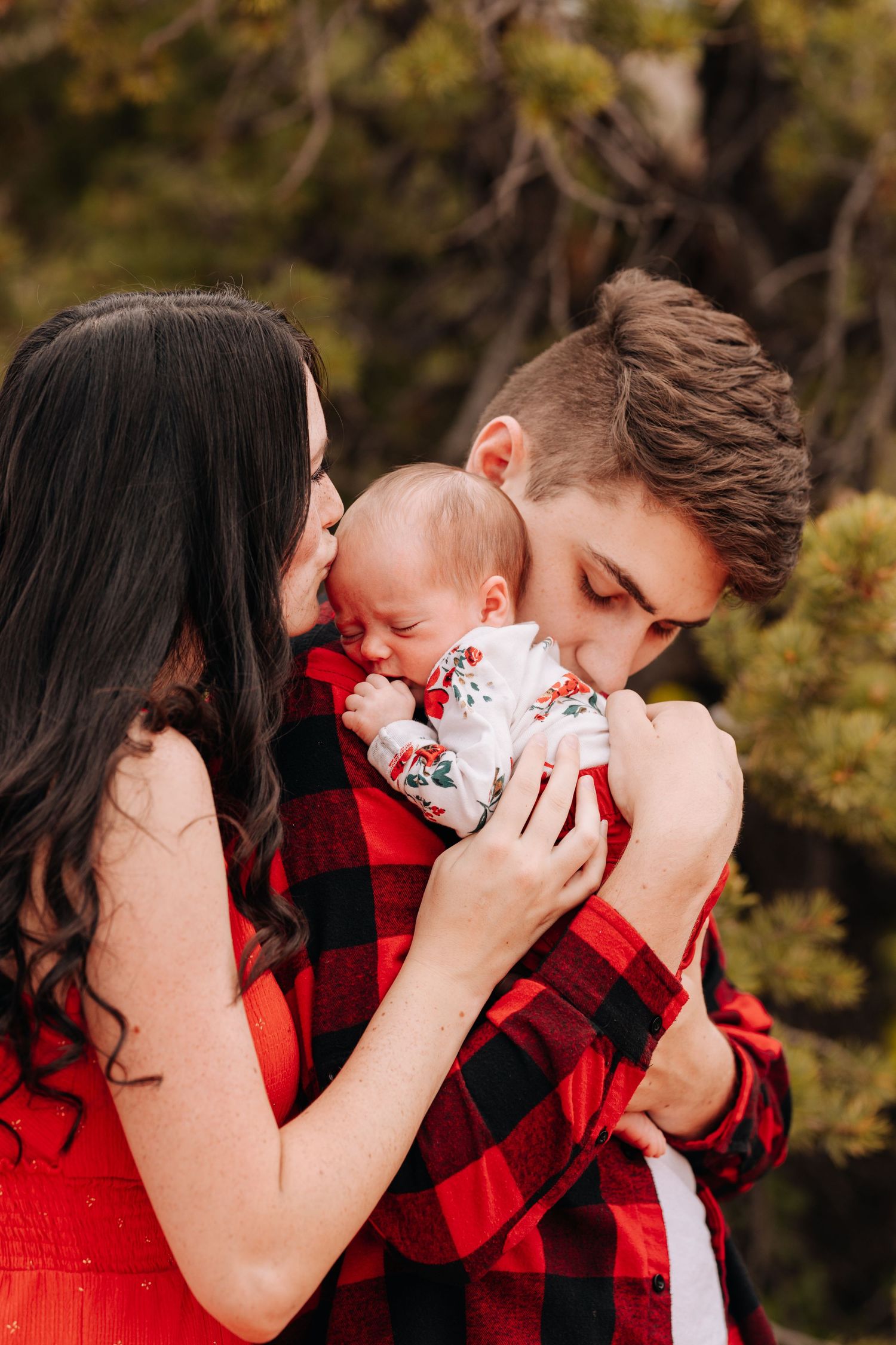 parents looking at their newborn baby