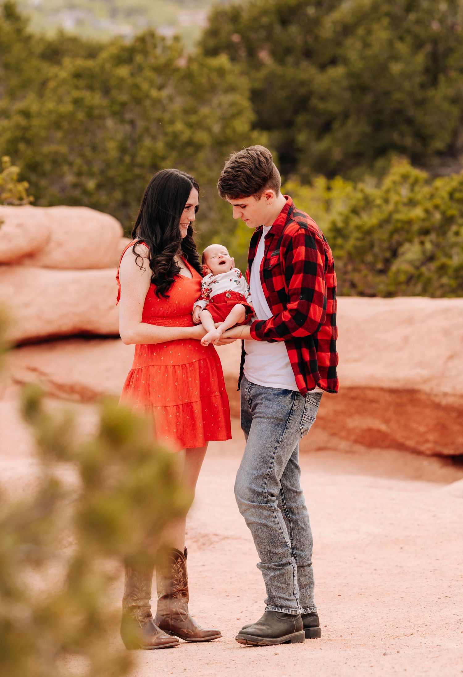 parents holding their newborn baby