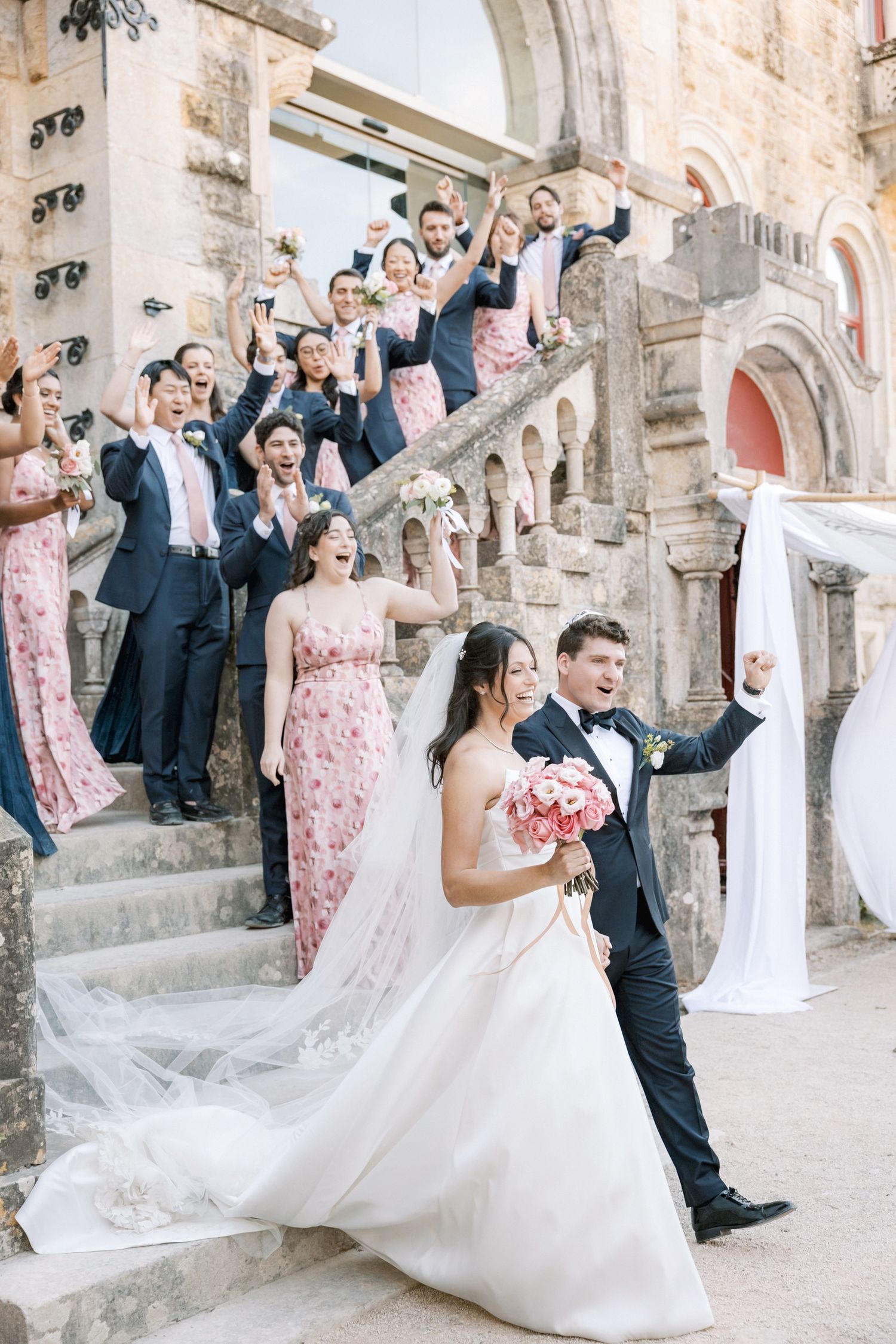 Wedding party celebrating together before reception at Forte da Cruz Portugal