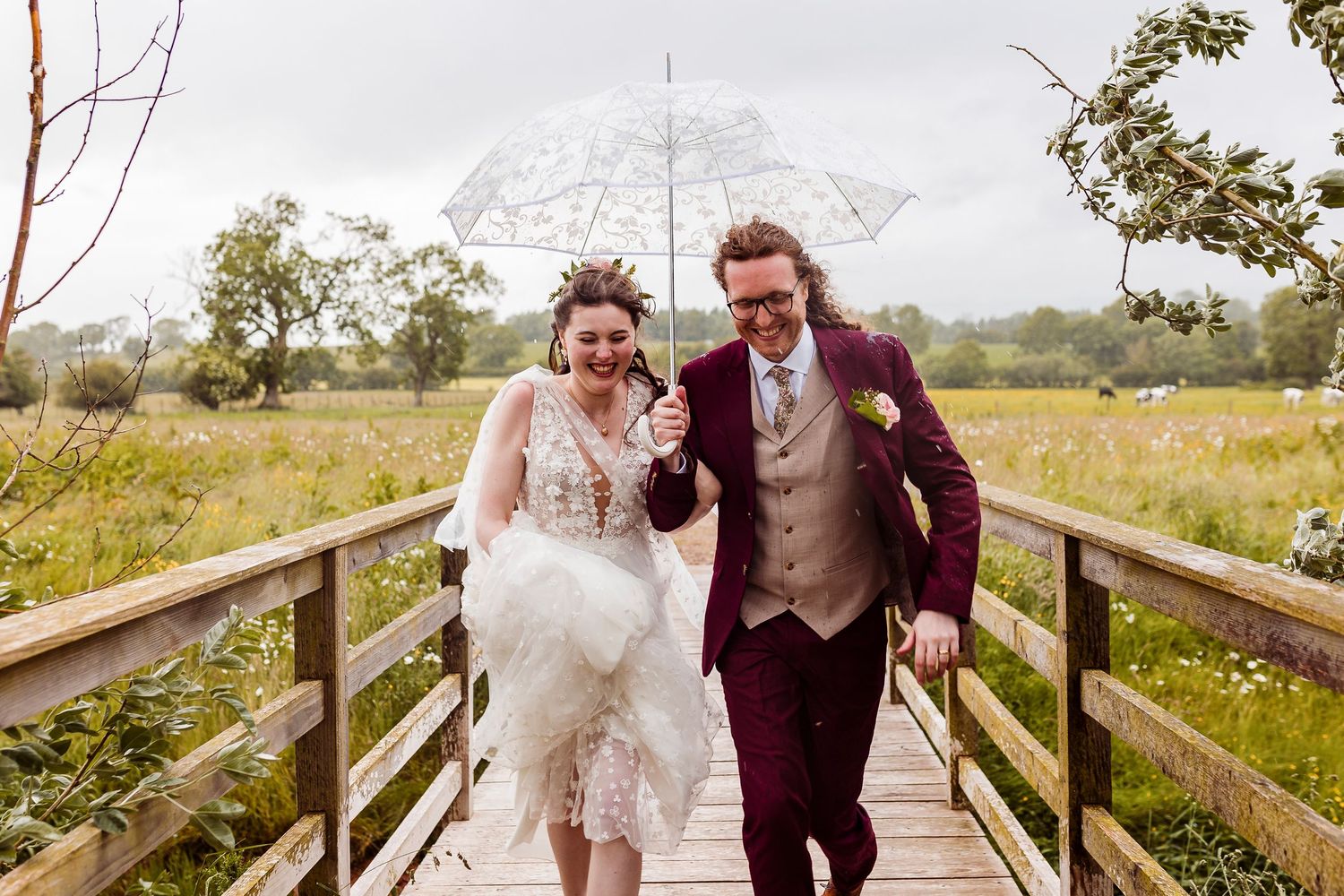 Rainy wedding photo with umbrellas