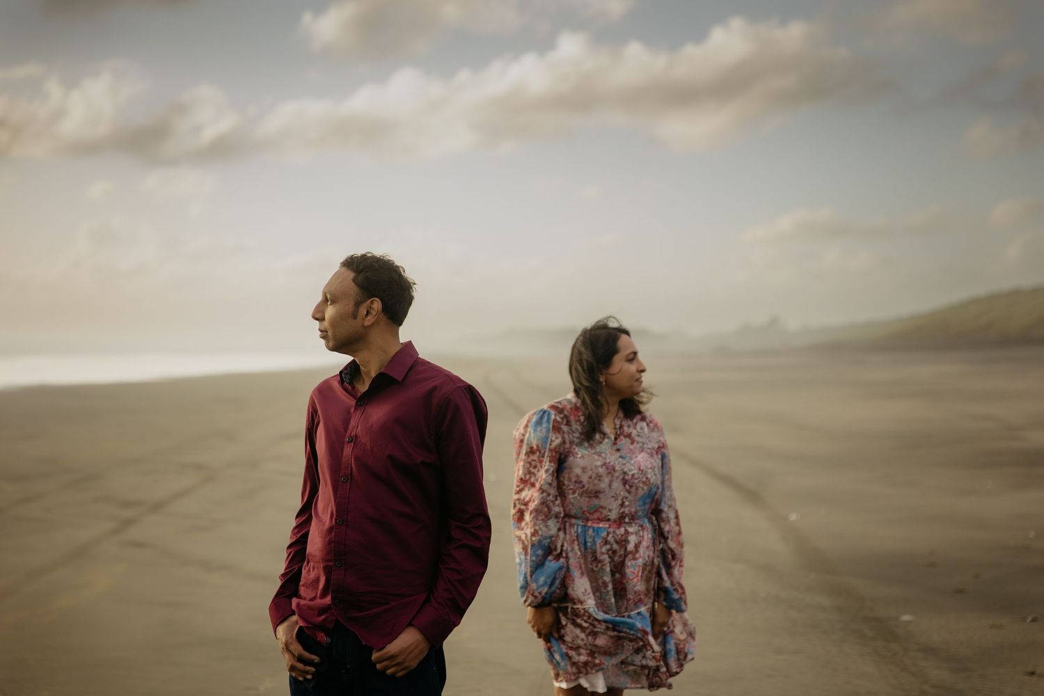 Creative sunset couples photo shoot West Auckland beach