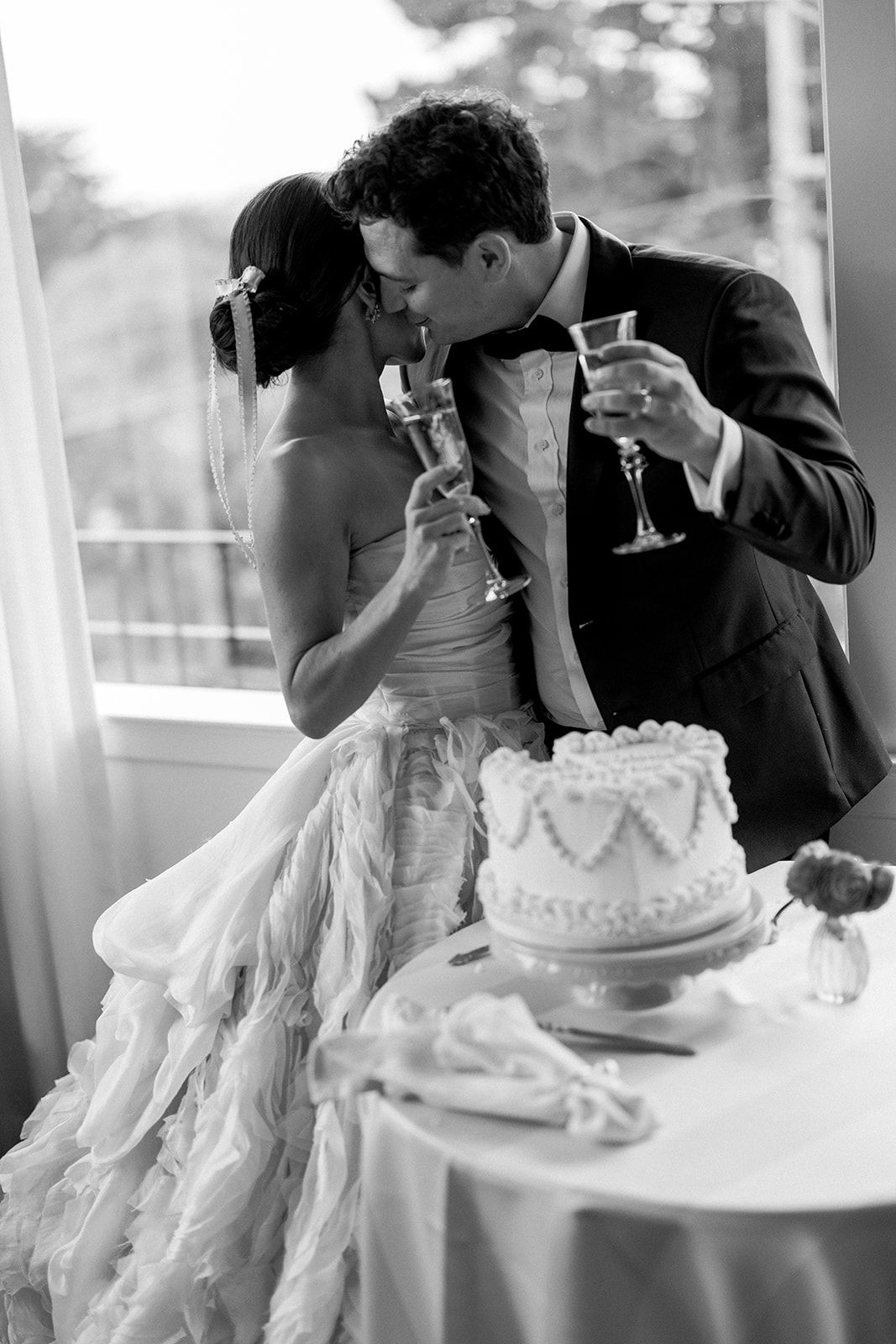 Bride and groom cake cutting at La Playa Carmel by the sea.