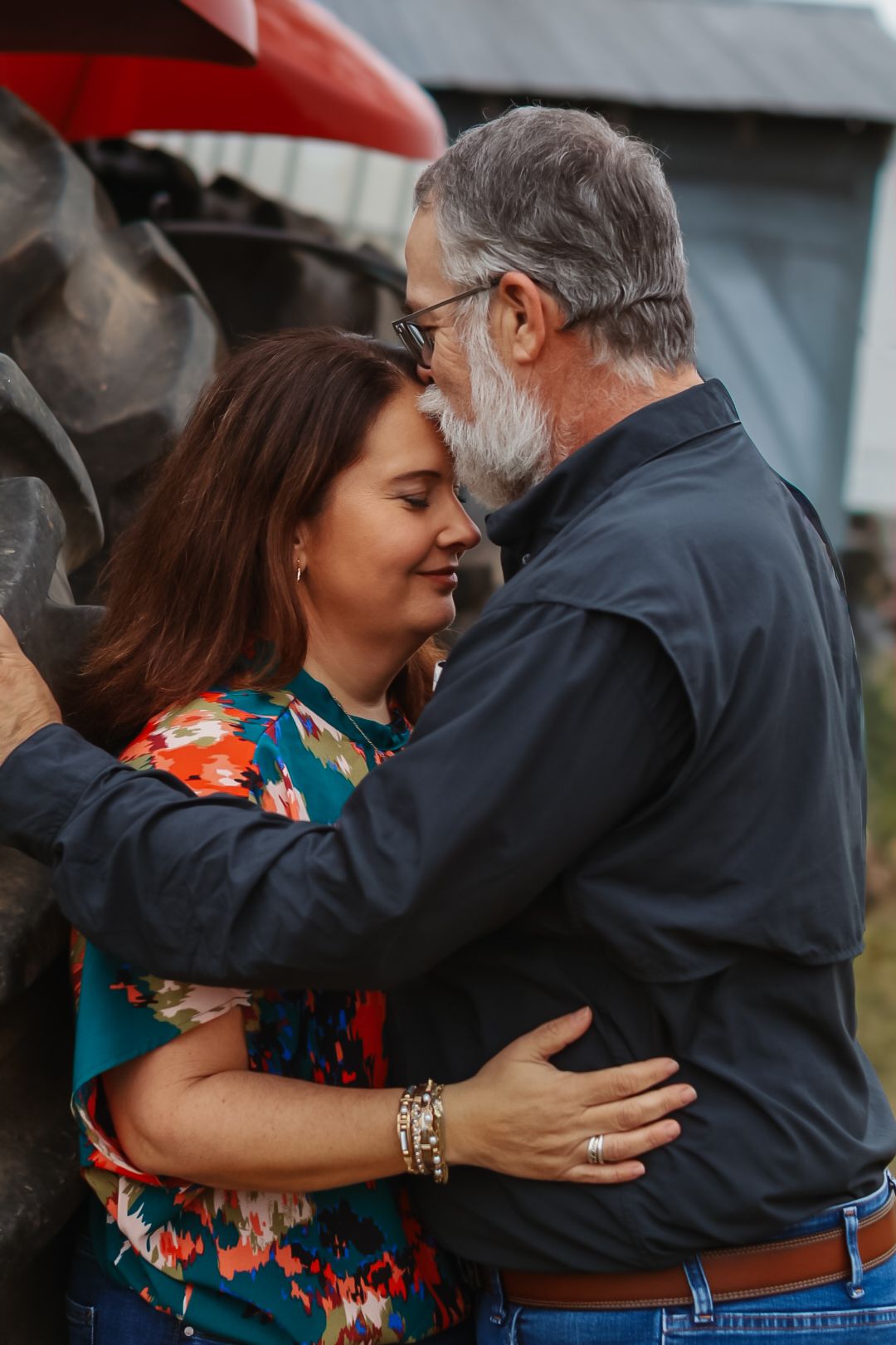 A touching embrace captured during an outdoor family photo session.