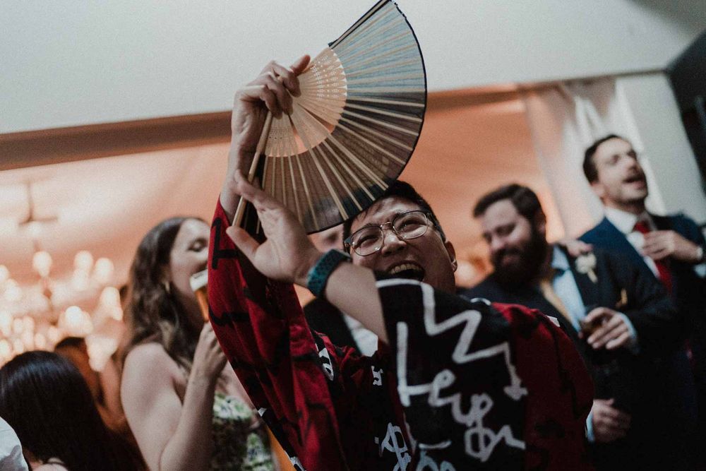 wedding guest dancing with fan reception porto