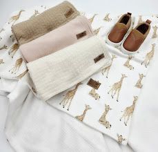 A collection of white and beige clothing items, shoes, and accessories arranged in a minimalist flatlay style.