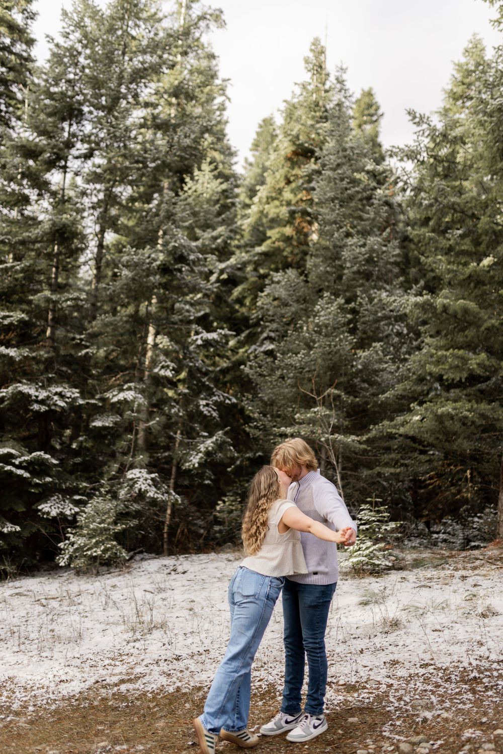 Couple dancing together during an intimate couples session in a Montana forest