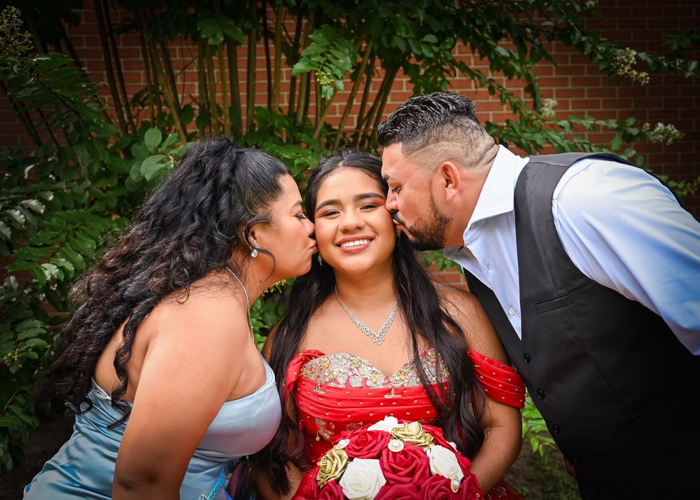 A romantic outdoor photo collage showing intimate moments and embraces against a natural backdrop of greenery and brick walls.